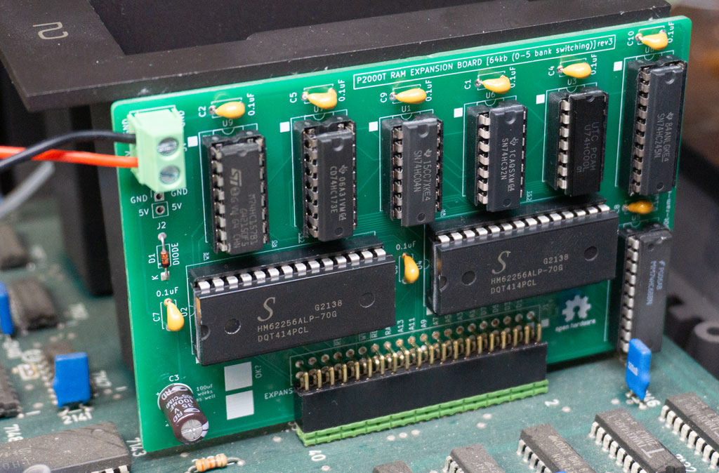 Placement of the RAM expansion board onto the main board.