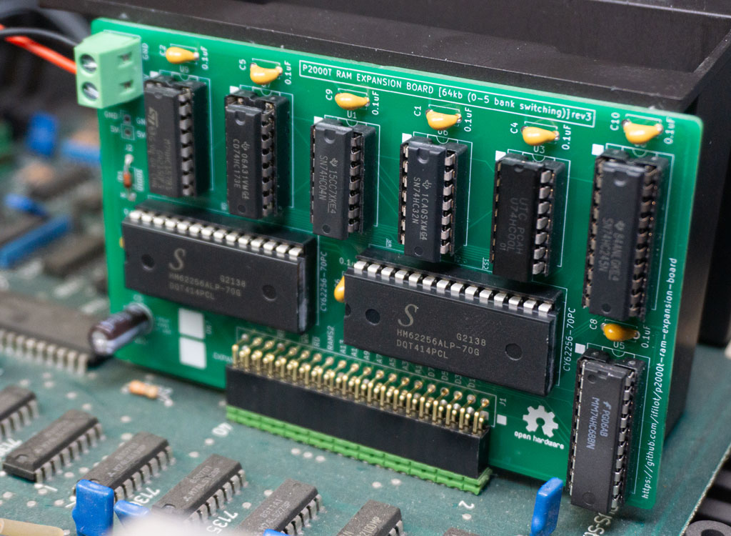 Placement of the RAM expansion board onto the main board.